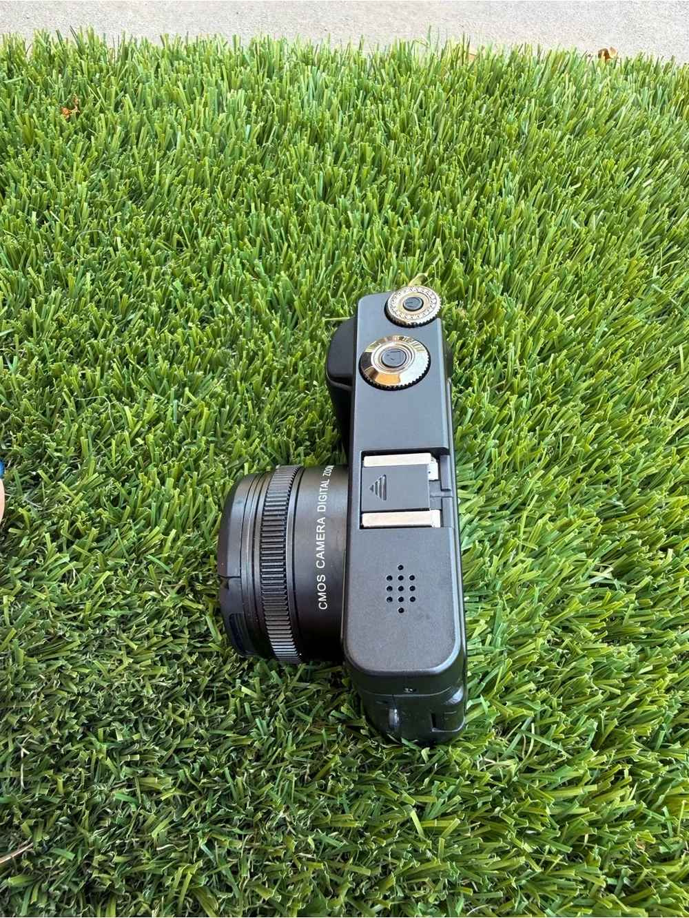 Compact Black Digital Camera with Accessories and Lens Cap